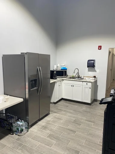 Pantry with refrigerator, sink, and counter space