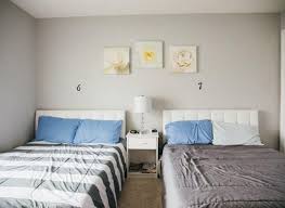 Two beds with nightstand in a shared guest bedroom