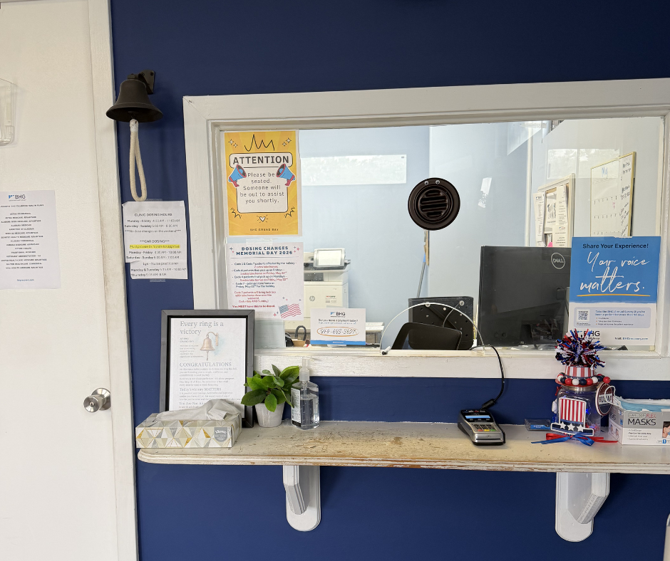 Reception check-in window with patient service counter