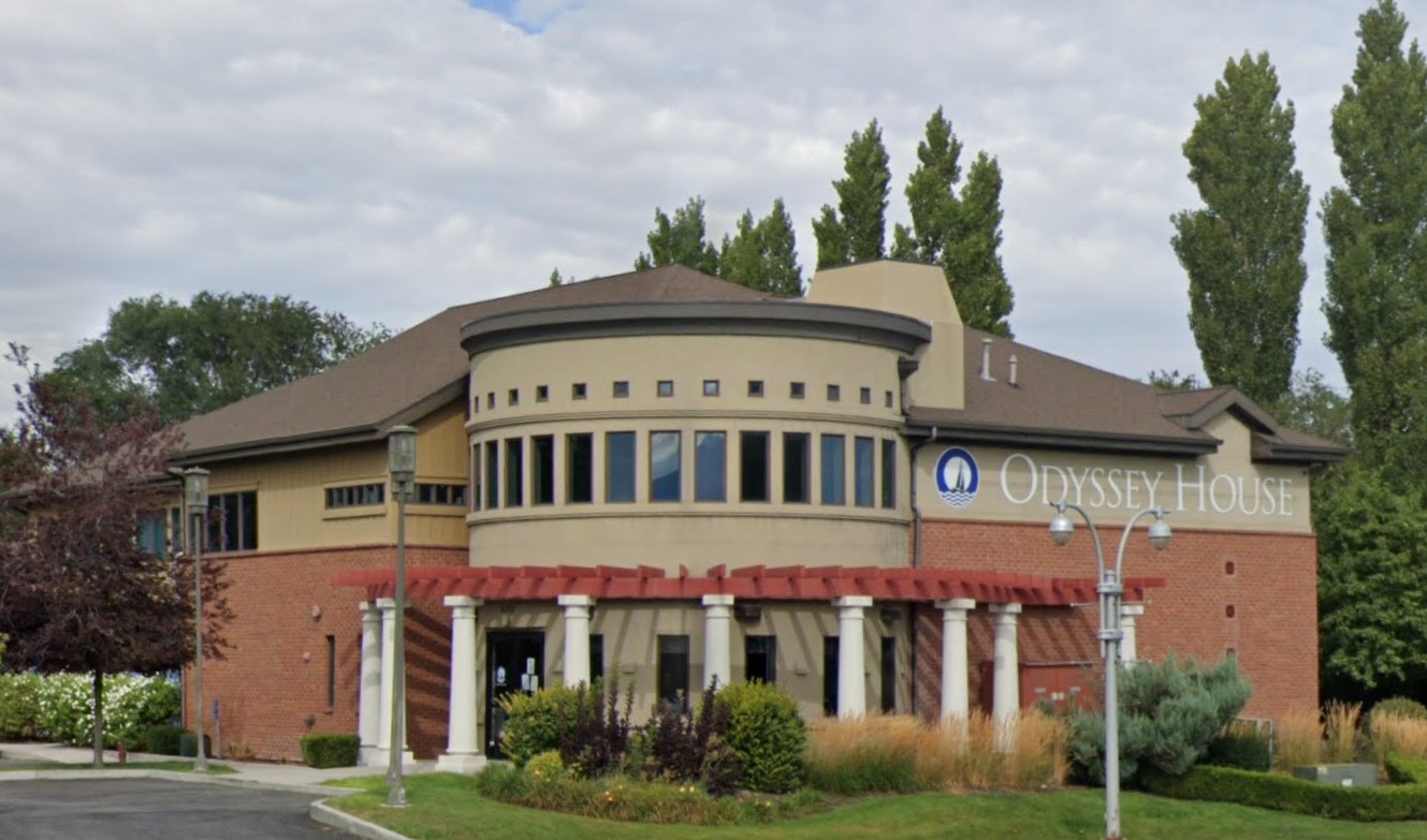 Street view of Odyssey House Outpatient, a well-maintained facility with lush landscaping.