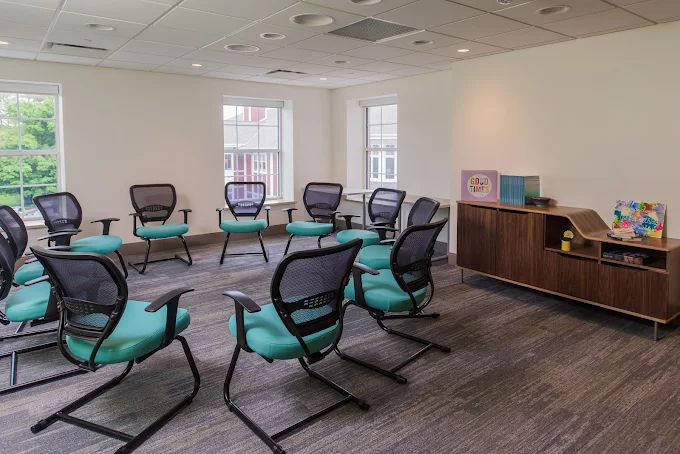 Circle of chairs arranged for group therapy session