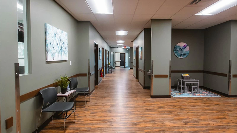 Hallway with chairs and small waiting area
