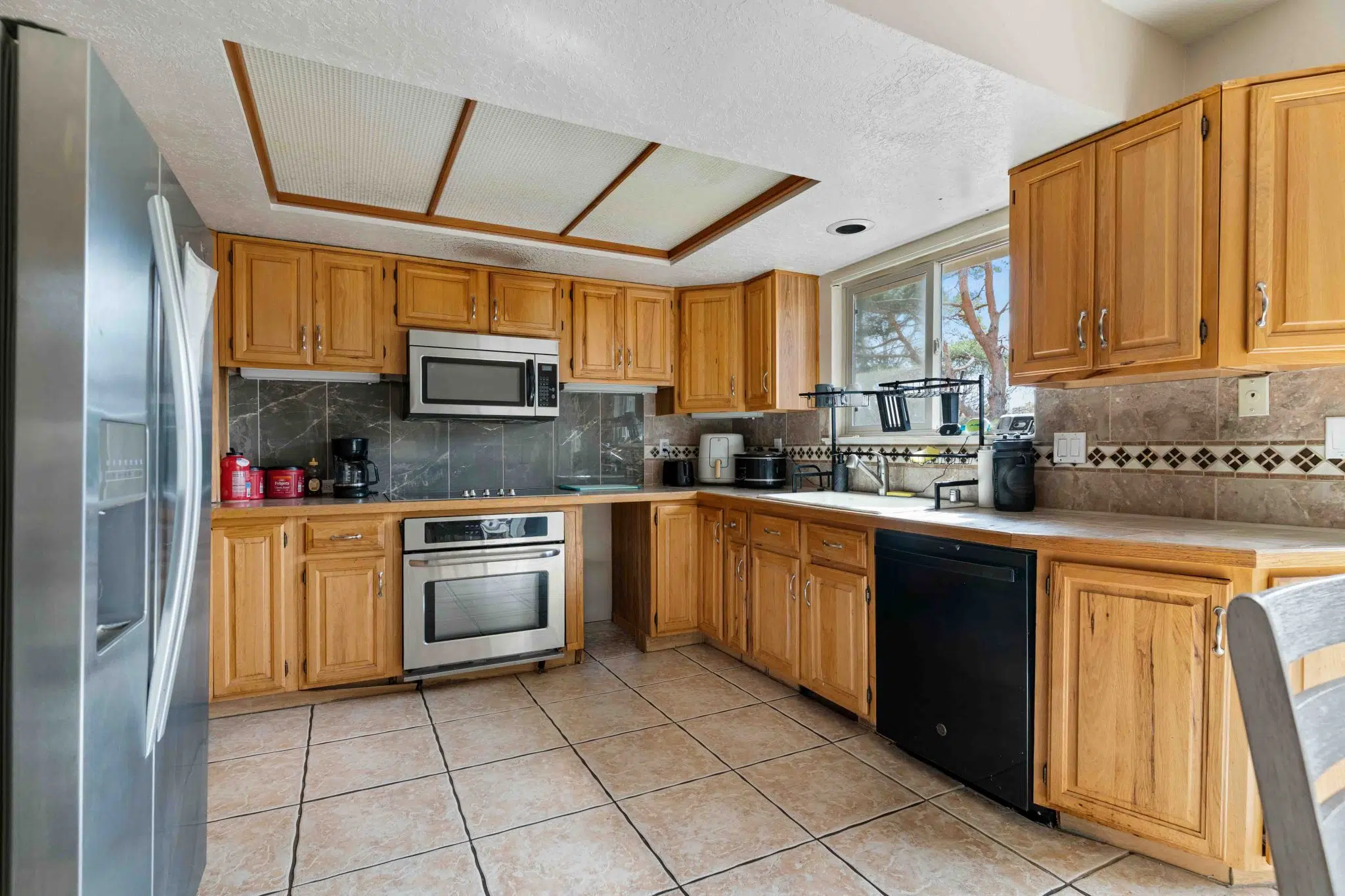 Community kitchen with full-size appliances and cabinets