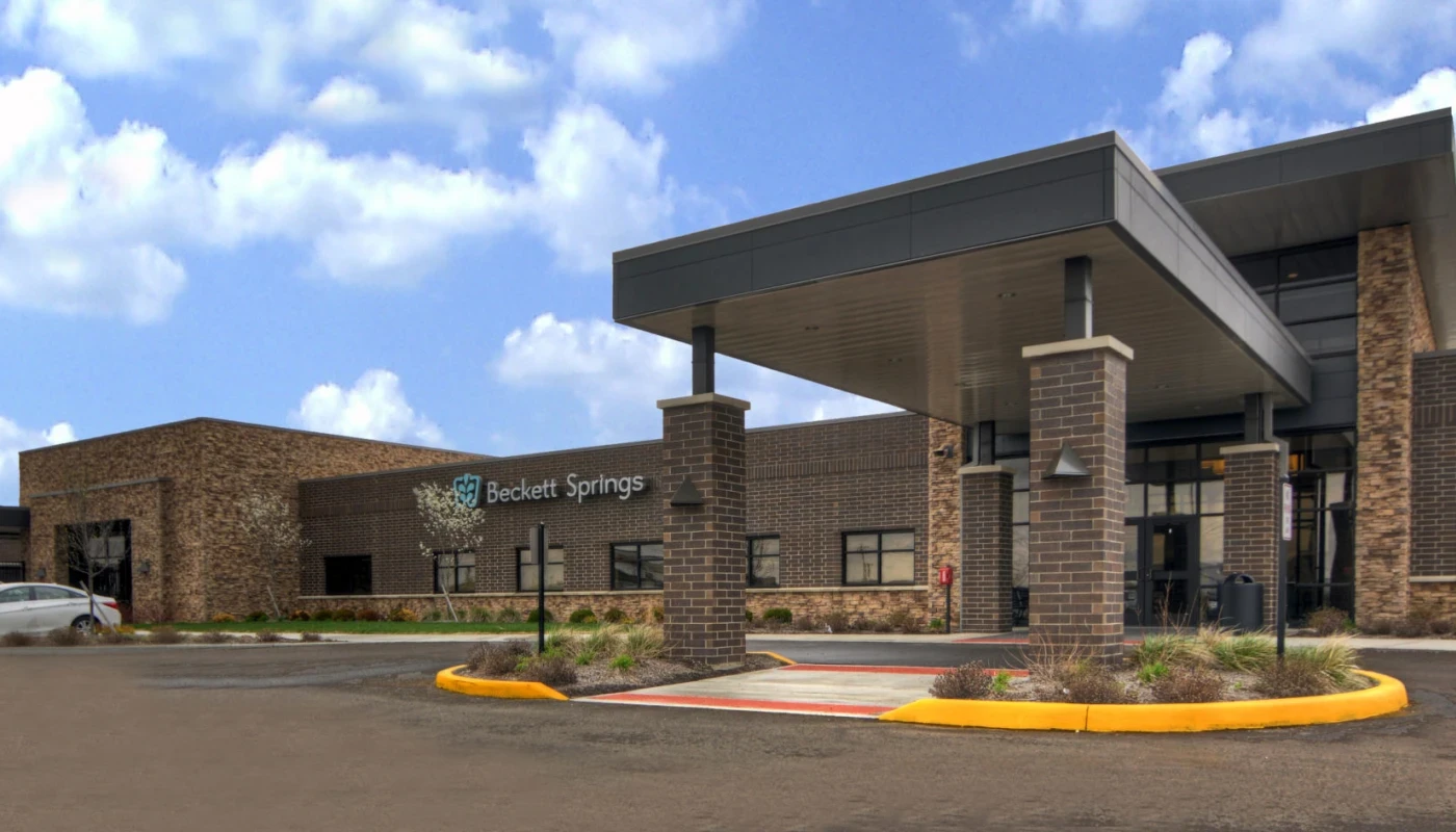  Front entrance with drive-up canopy and signage