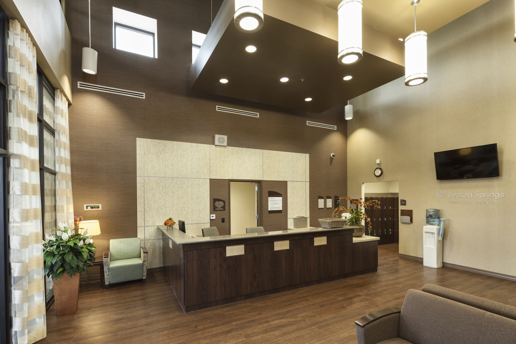 Reception desk with seating and modern lighting