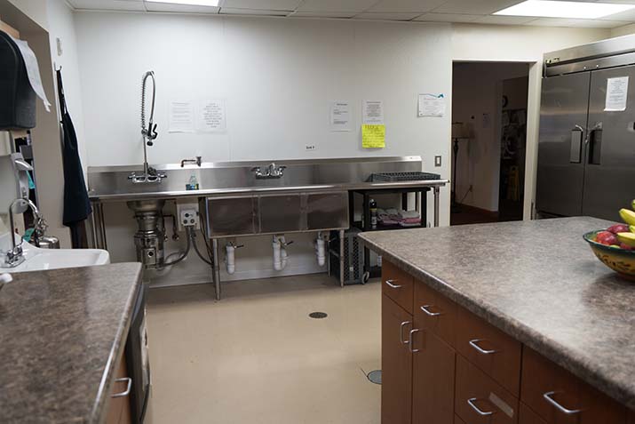 Commercial kitchen with large sink and counters
