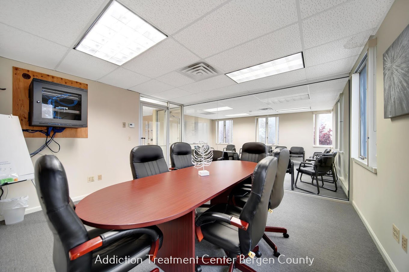 Conference room with a table and chairs.