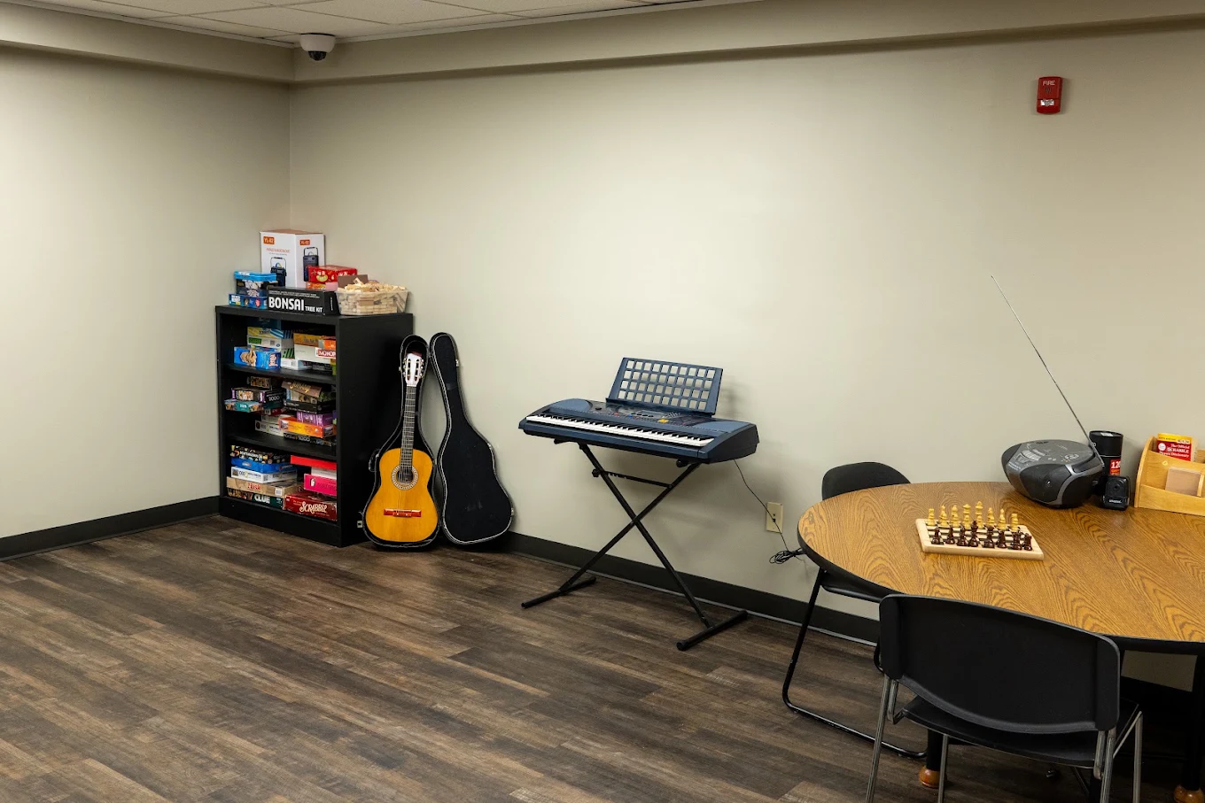 Recreation room with board games, guitar, and keyboard