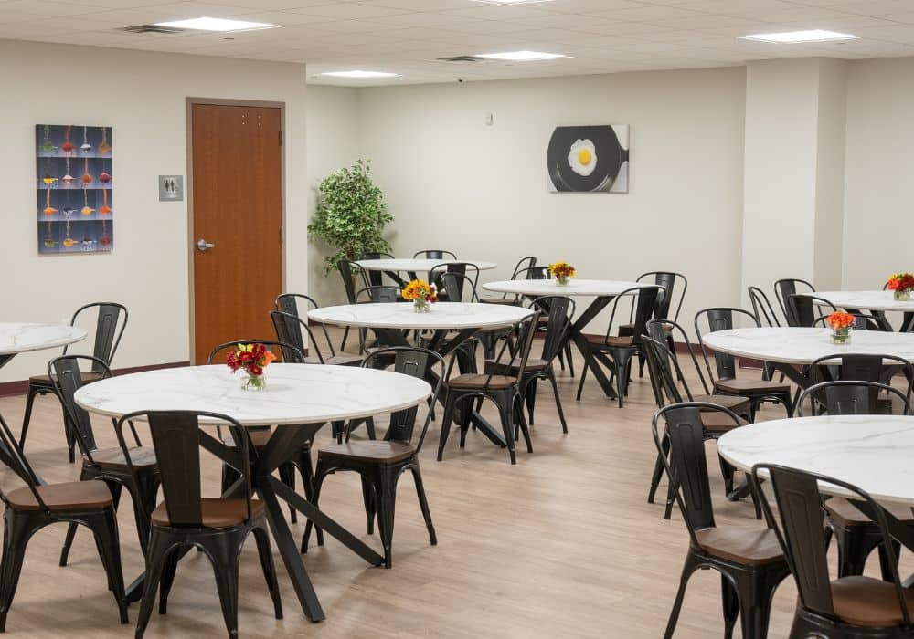 Bright dining room with round tables and chairs
