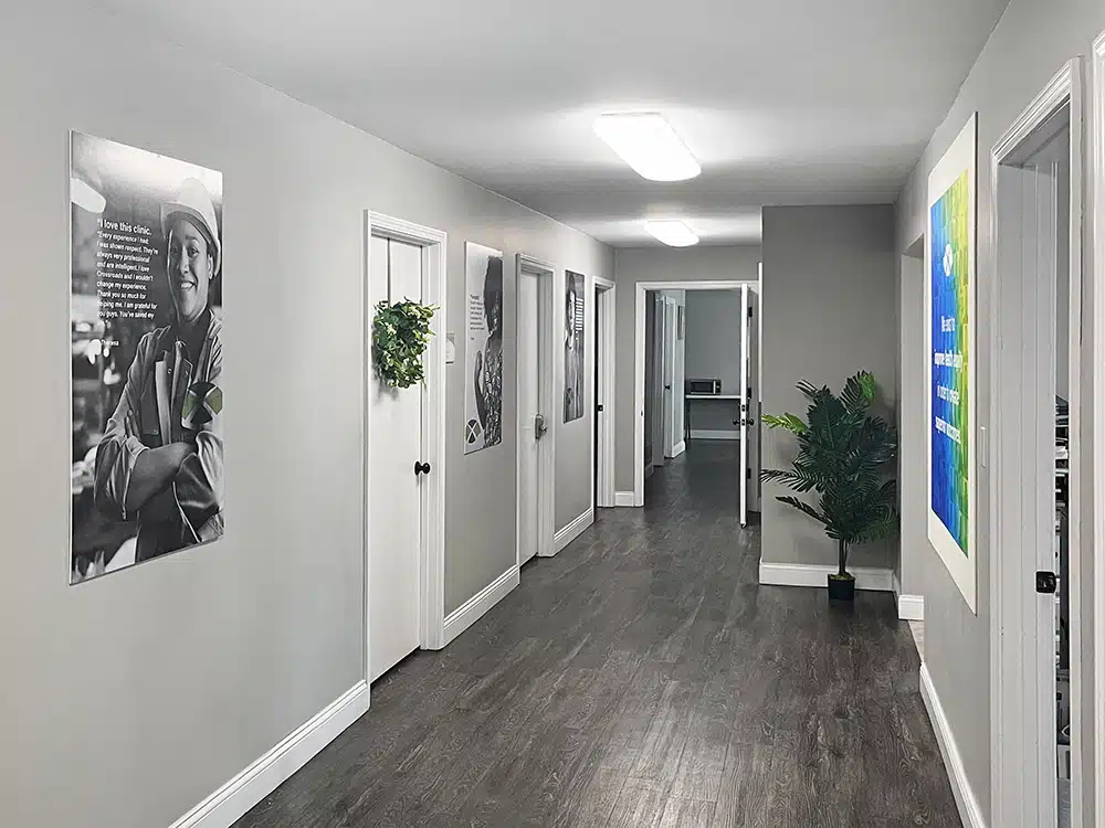Hallway with doors to counseling rooms and wall artwork