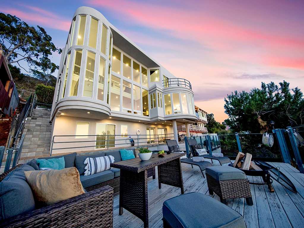 Modern multi-story facility with curved glass and deck