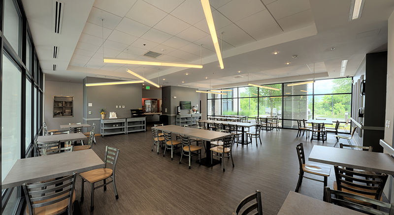 Spacious dining room with tables and large windows