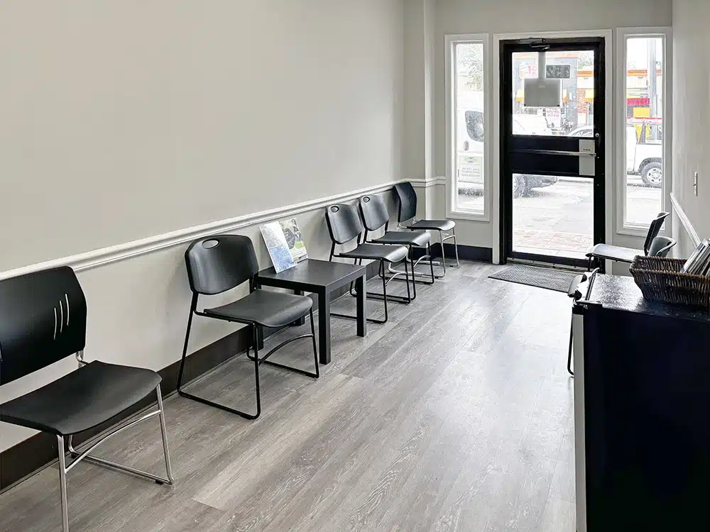 Waiting area with chairs facing front entrance door
