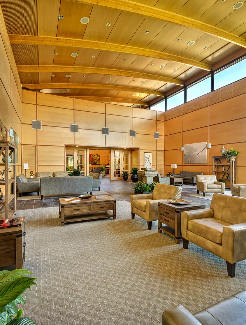 Spacious lounge with modern furniture and natural lighting.