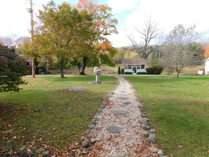 Gravel walking path through open green space