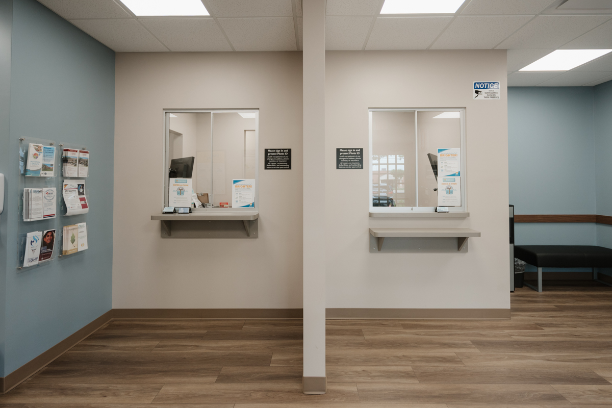 Front desk area with two patient service windows