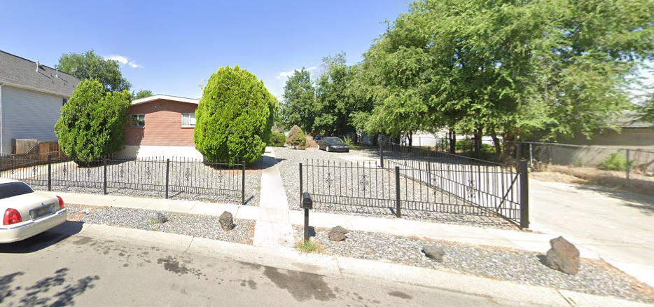 Single-story home with fenced yard and driveway