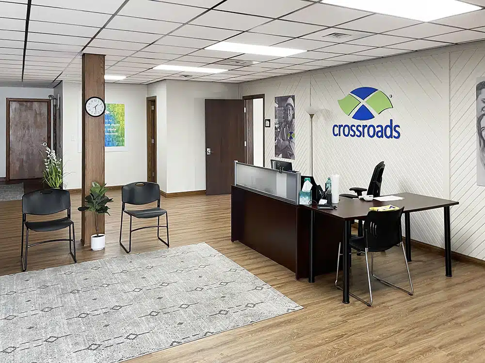 Reception desk with chairs and open lobby space