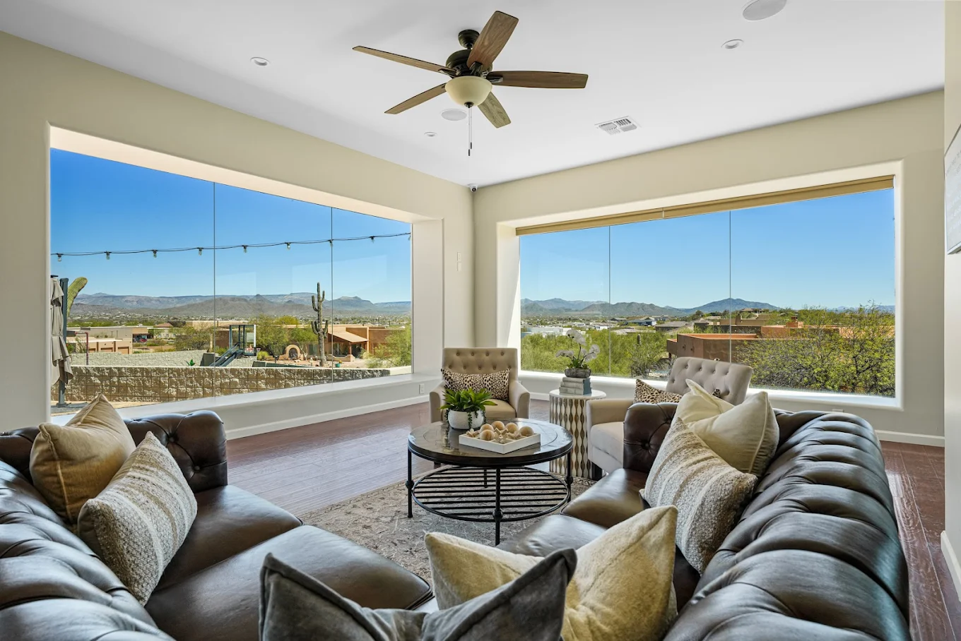 Bright living room with large windows and mountain views