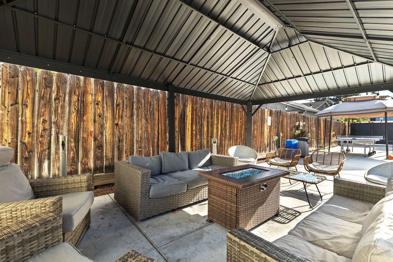 Patio seating under canopy with fire table