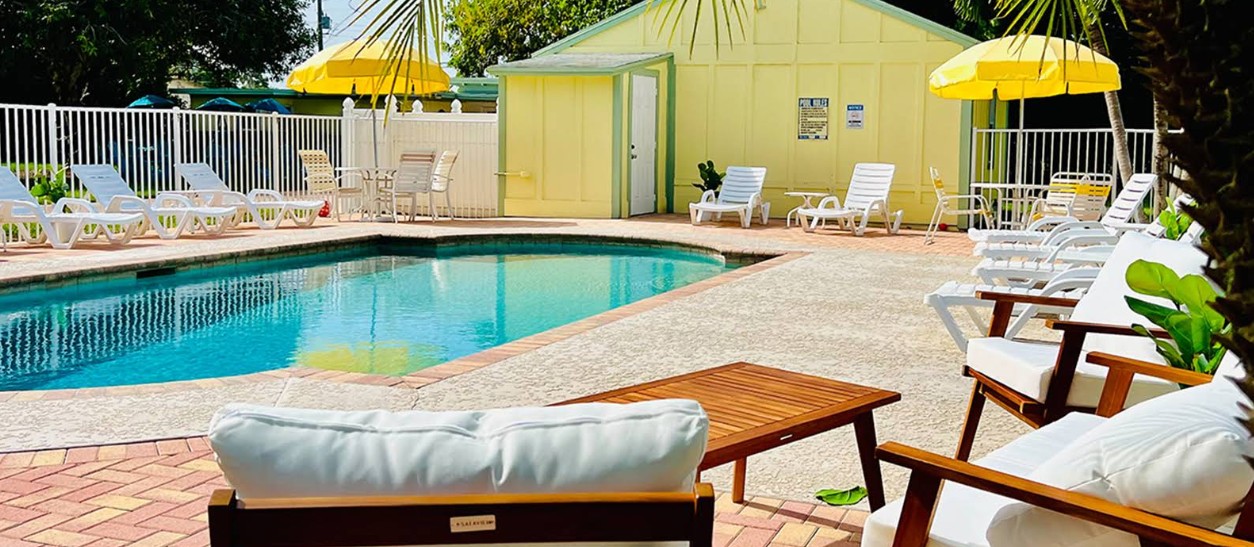 Outdoor pool with lounge chairs and umbrellas