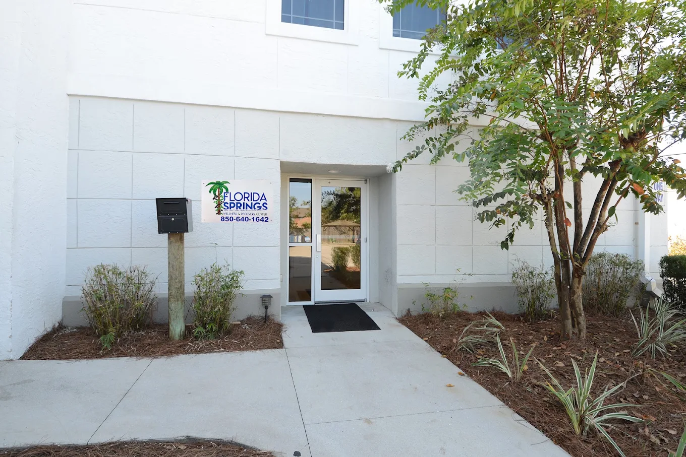 Facility entrance with Florida Springs sign and landscaping