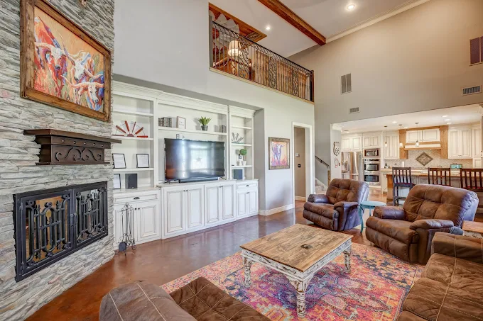 Spacious living room with fireplace and entertainment center