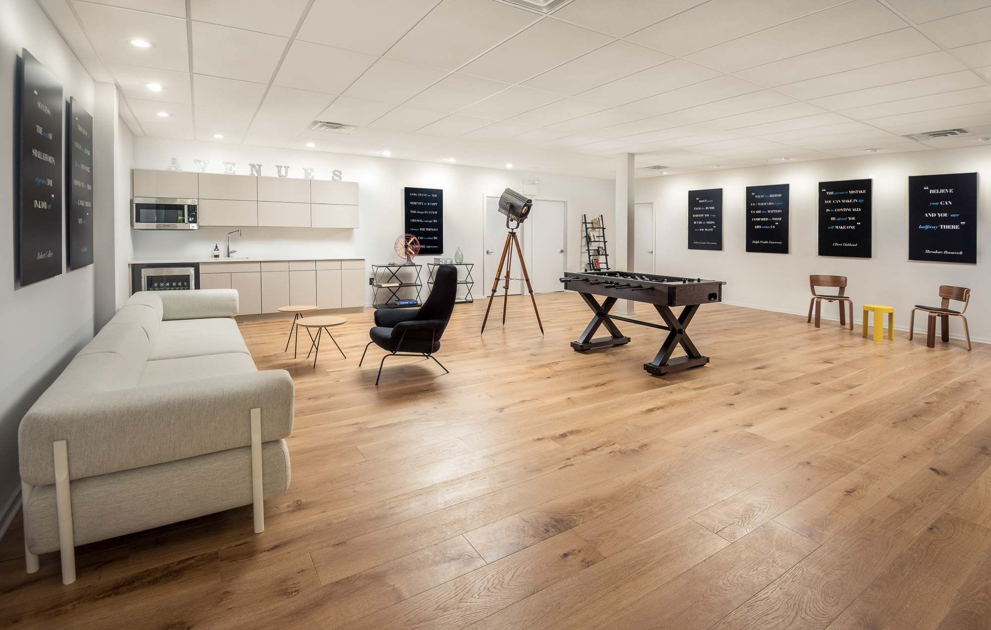 Spacious lounge with foosball, kitchenette, and couch