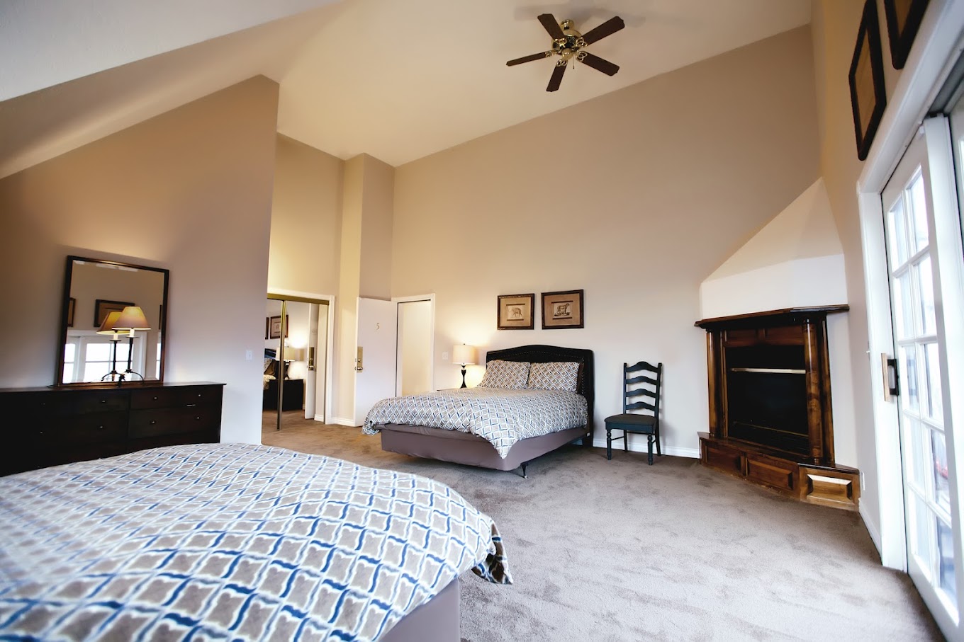 Cozy bedroom with two beds and warm lighting