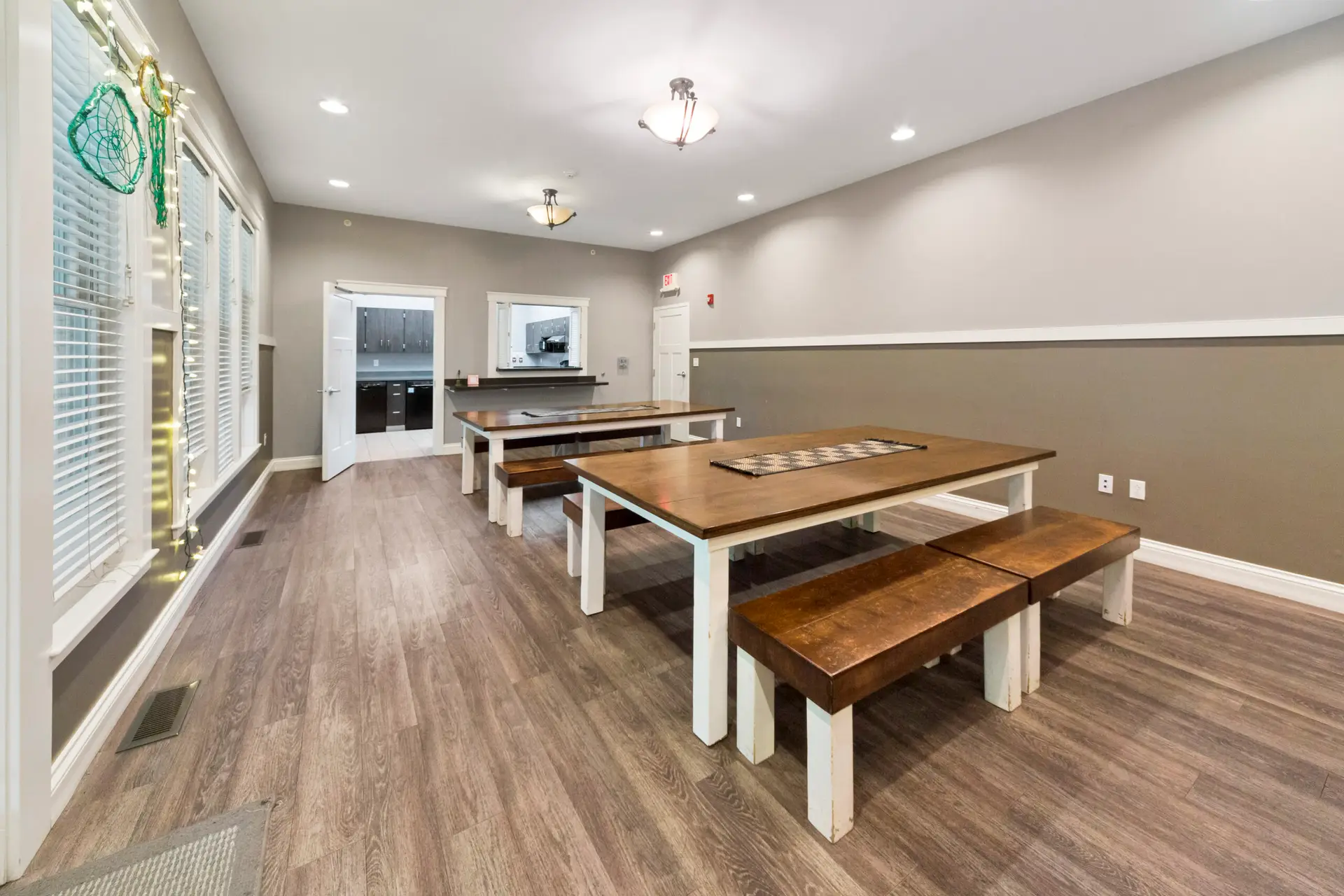 Communal dining area with long tables at Oak House