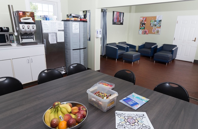 Pantry area with table, snacks, and seating