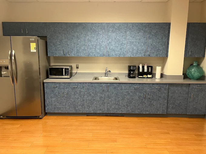 Break room with sink, microwave, fridge, and coffee maker
