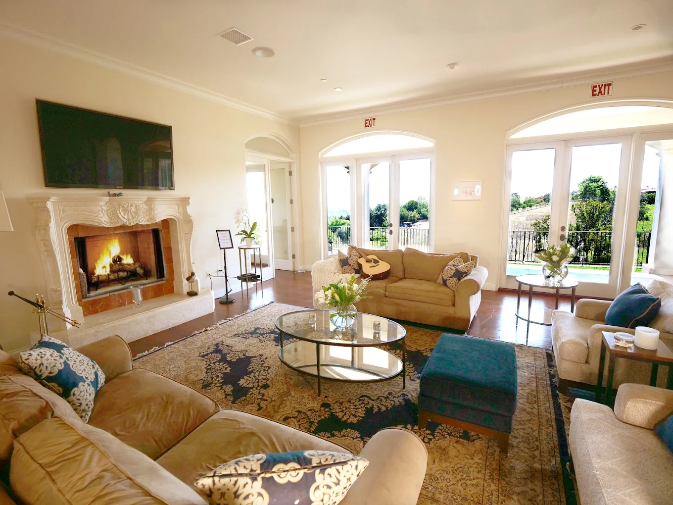 Cozy living room with fireplace and multiple sofas