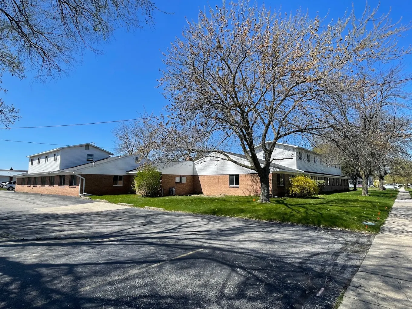 Rehab building with trees and parking area