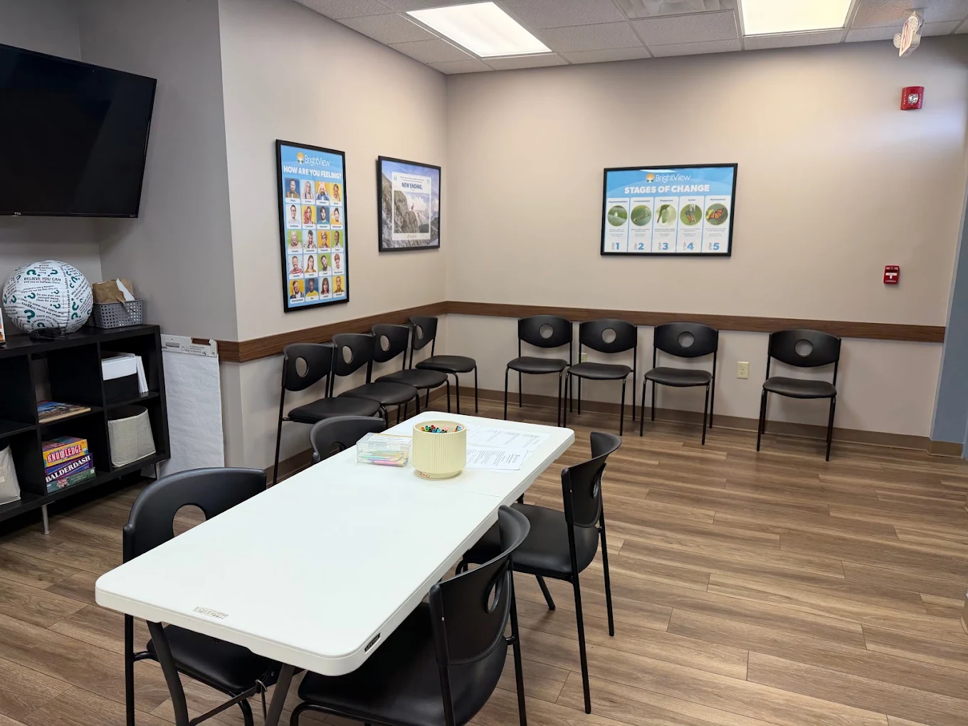 Group therapy room with chairs and a central table