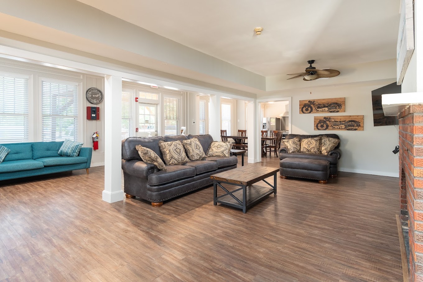 Lving space with sofas, a fireplace, and a TV.