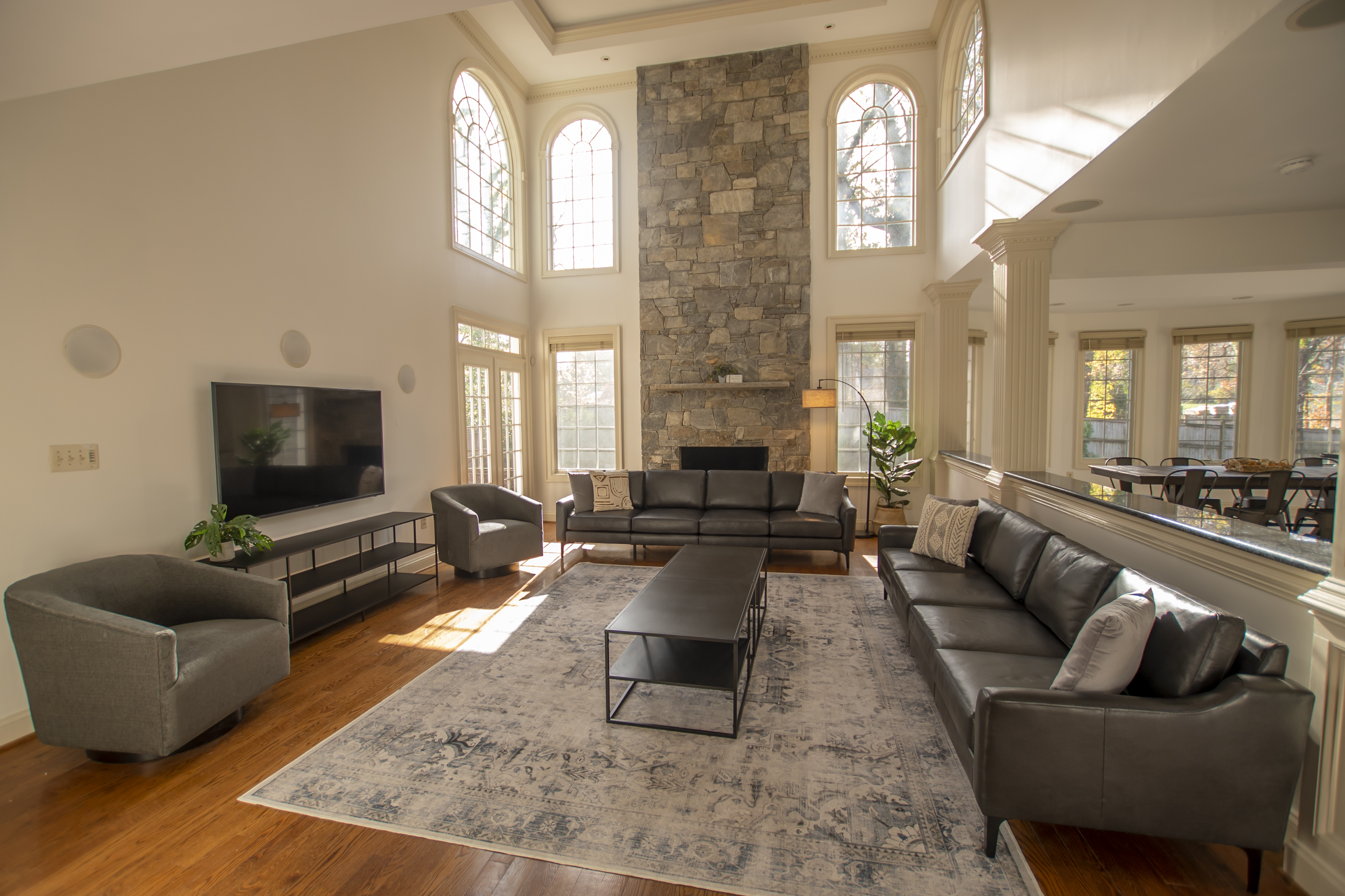 Open-concept living room with high ceilings.