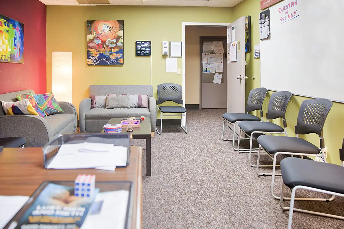 Comfortable counseling room with chairs and whiteboard