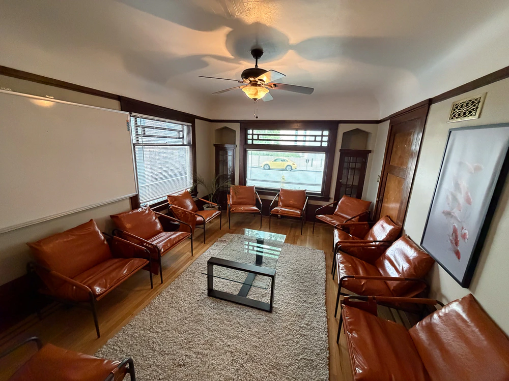 Waiting room with leather chairs and coffee table