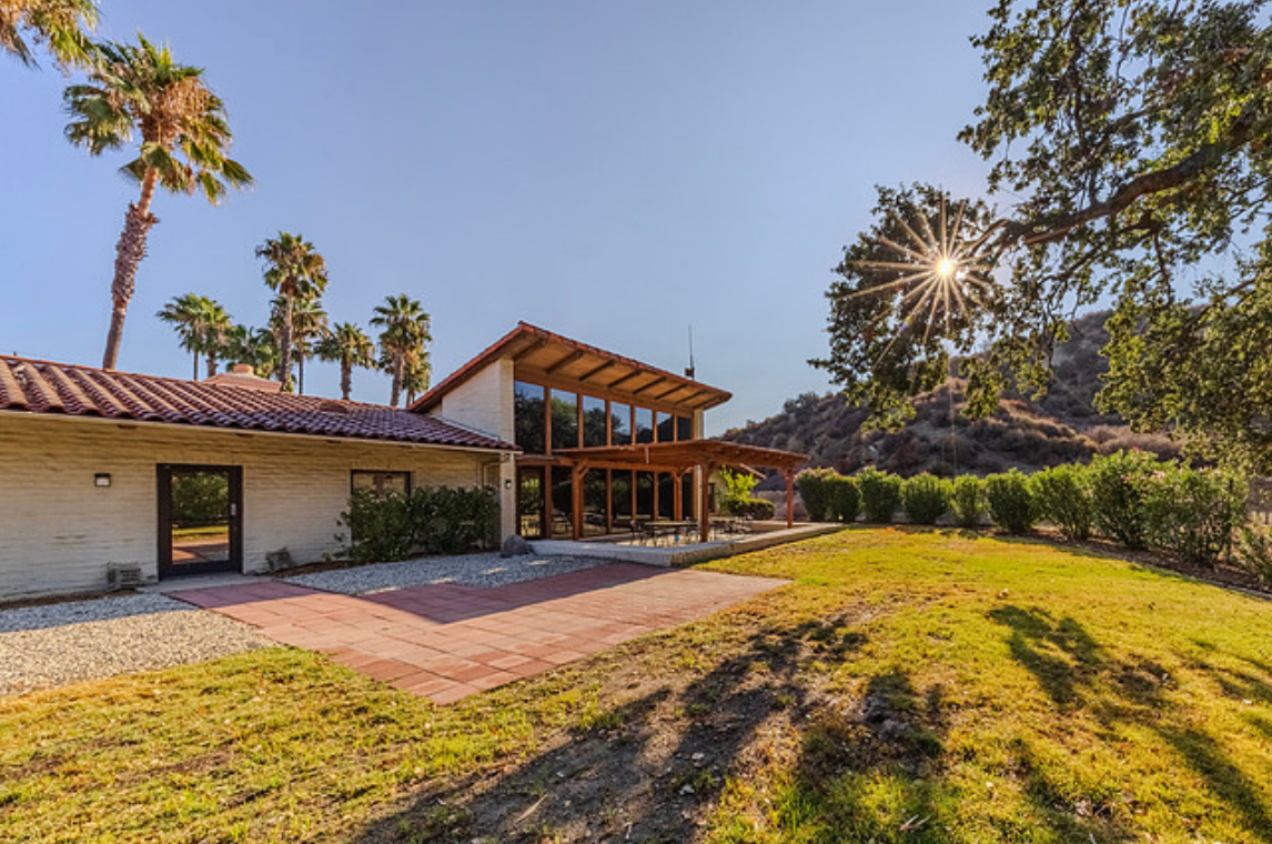 Rehab facility backyard with large windows and patio.