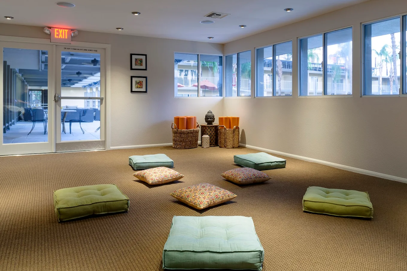 Meditation room with floor cushions and yoga mats