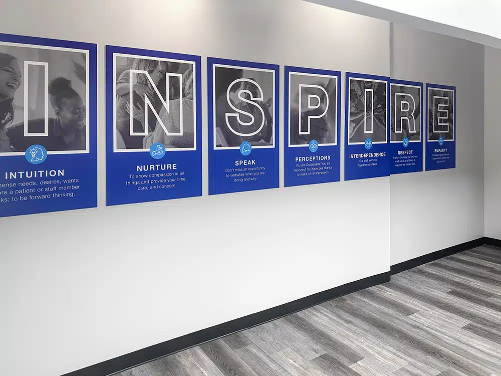 Inspirational INSPIRE wall display in rehab facility hallway