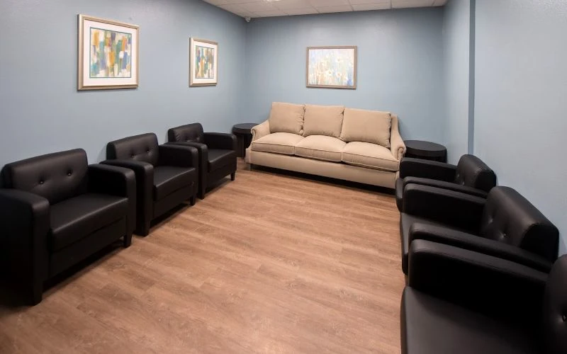 Group room with black and beige seating in a circle