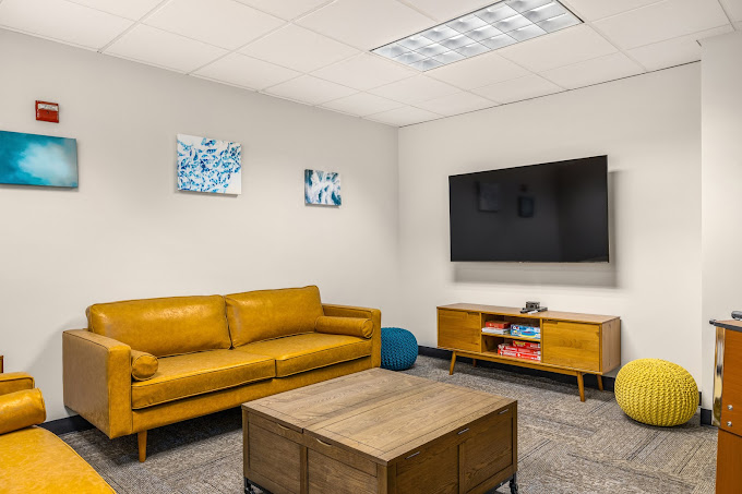 Lounge with a sofas and TV.