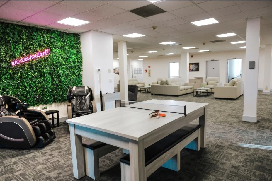 Recreation area with ping pong table and massage chairs