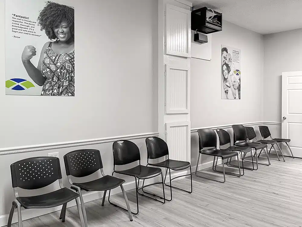 Side view of waiting area with chairs and recovery posters