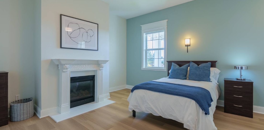 Private bedroom with fireplace and queen bed