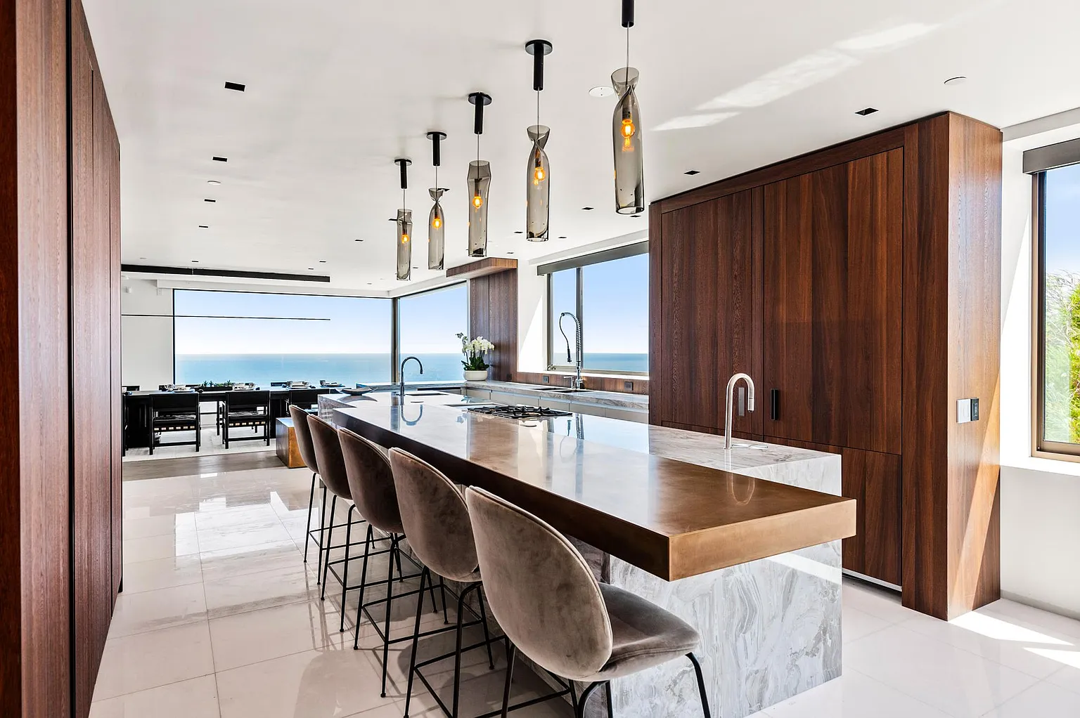 Gourmet kitchen with island seating and ocean views