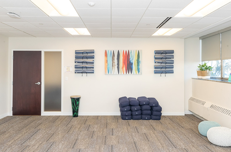 Yoga and therapy room with mats and cushions