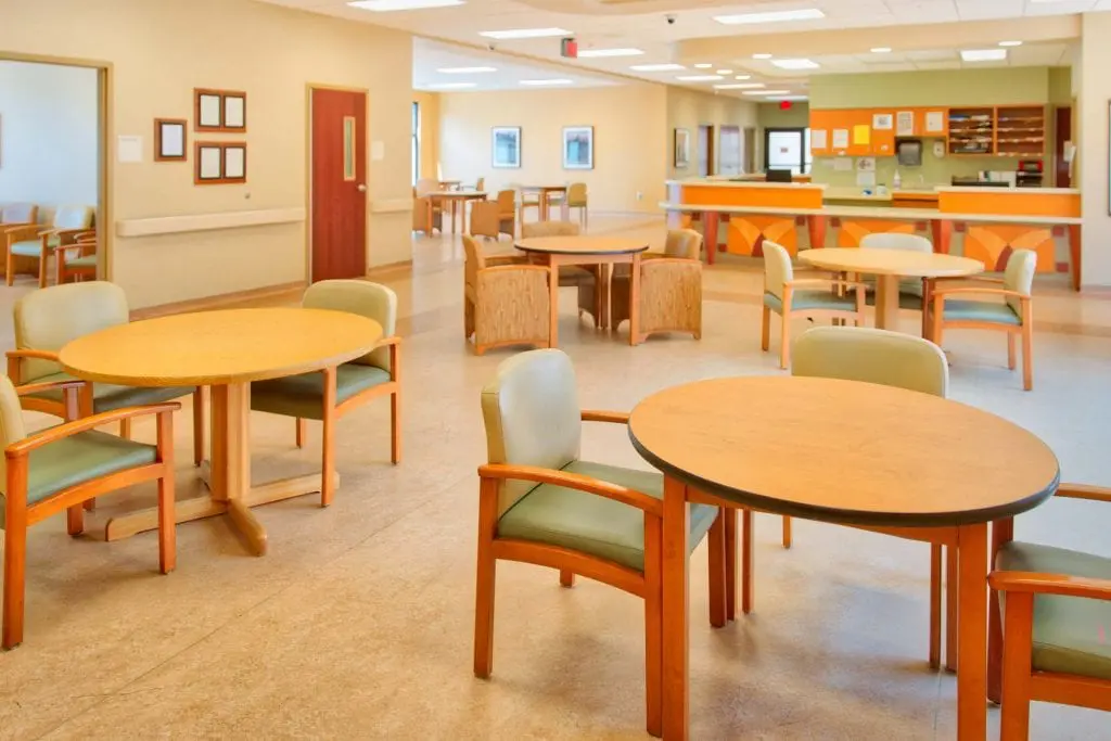 Open dining area with tables and chairs for residents